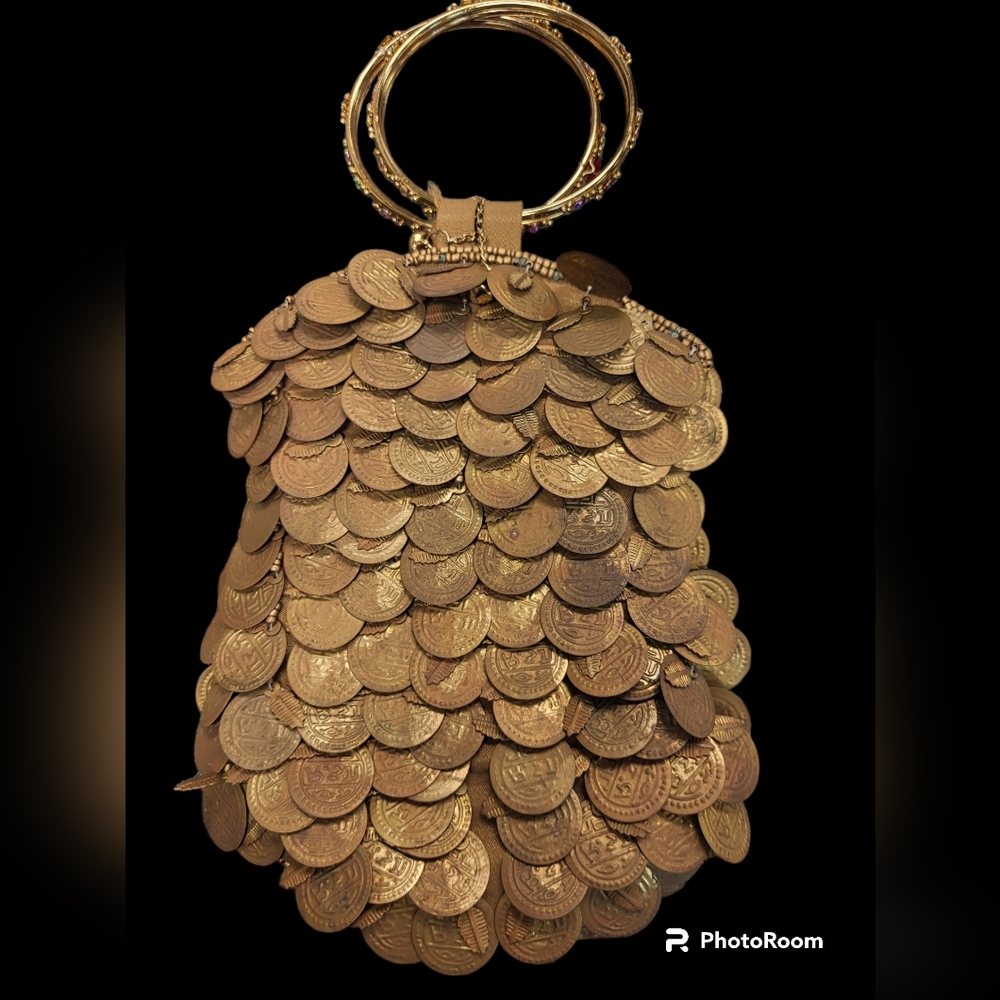 Bougainvillea Bracelet Handle purse covered in gold coins.